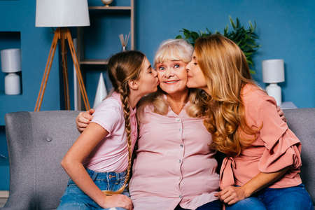 Grandmother, daughter and grandchild together at home, happy domestic life moments - Family having...