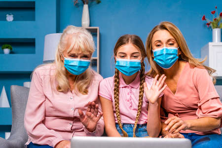 Grandmother, daughter and grandchild together at home, happy domestic life moments - Family having fun, concepts about elderly, mult-generation family and relationshipの写真素材