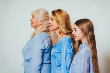 Grandmother, daughter and grandchild together at home, happy domestic life moments - Family having fun, concepts about elderly, mult-generation family and relationshipの写真素材