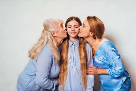Grandmother, daughter and grandchild together at home, happy domestic life moments - Family having fun, concepts about elderly, mult-generation family and relationshipの写真素材