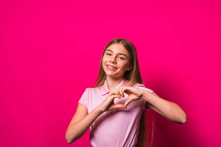 Beautiful cute girl at elementary school at home - Child in young age smiling, concepts about family, infant and lifestyleの写真素材