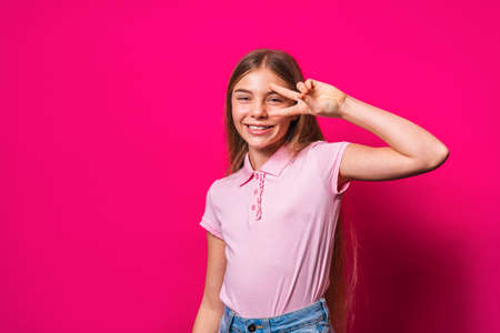 Beautiful cute girl at elementary school at home - Child in young age smiling, concepts about family, infant and lifestyleの写真素材