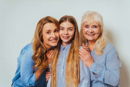 Grandmother, daughter and grandchild together at home, happy domestic life moments - Family having fun, concepts about elderly, mult-generation family and relationshipの写真素材