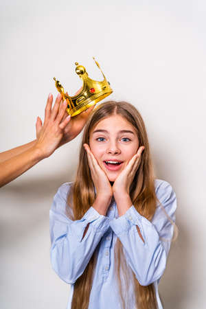 Beautiful cute girl at elementary school at home - Child in young age smiling, concepts about family, infant and lifestyleの写真素材