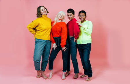 group of multiethnic women with different kind of skin posing together in studio. Concept about body positivity and self acceptanceの写真素材