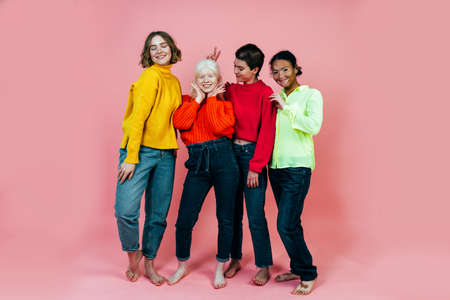 group of multiethnic women with different kind of skin posing together in studio. Concept about body positivity and self acceptanceの写真素材