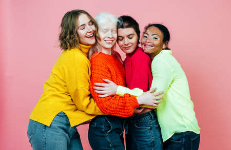 group of multiethnic women with different kind of skin posing together in studio. Concept about body positivity and self acceptanceの写真素材
