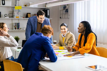 Project managers and employees brainstorming on ideas - Multi-ethnic group of workers having...