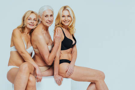 Beautiful senior woman with young and clean look, beauty shot - Pretty senior lady over 60 with perfect skin, concepts about elderly, beauty treatment and skin careの写真素材