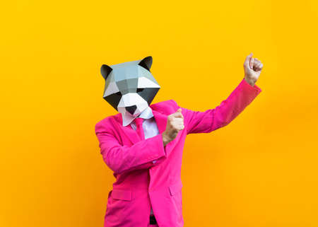 Happy man with funny low poly mask on colored background - Creative conceptual idea for advertising, adult with low-poly origami paper mask doing funny posesの写真素材