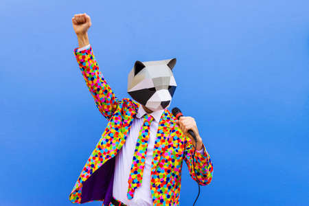 Happy man with funny low poly mask on colored background - Creative conceptual idea for advertising,...