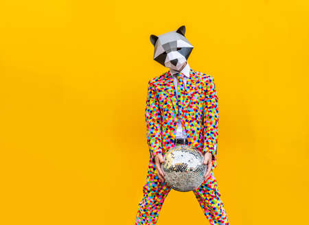 Happy man with funny low poly mask on colored background - Creative conceptual idea for advertising, adult with low-poly origami paper mask doing funny posesの写真素材