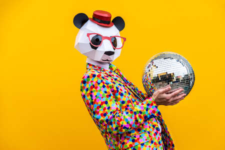 Happy man with funny low poly mask on colored background - Creative conceptual idea for advertising,...