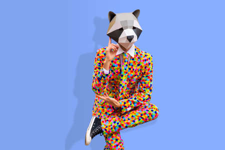 Happy man with funny low poly mask on colored background - Creative conceptual idea for advertising, adult with low-poly origami paper mask doing funny posesの写真素材