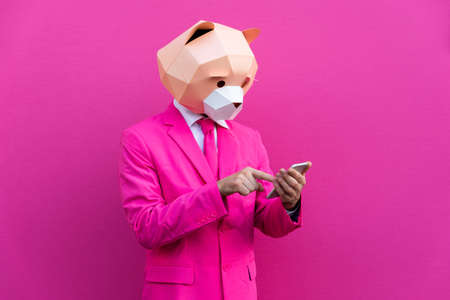 Happy man with funny low poly mask on colored background - Creative conceptual idea for advertising, adult with low-poly origami paper mask doing funny posesの写真素材