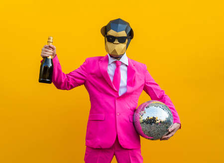 Happy man with funny low poly mask on colored background - Creative conceptual idea for advertising,...