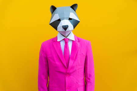 Happy man with funny low poly mask on colored background - Creative conceptual idea for advertising, adult with low-poly origami paper mask doing funny posesの写真素材