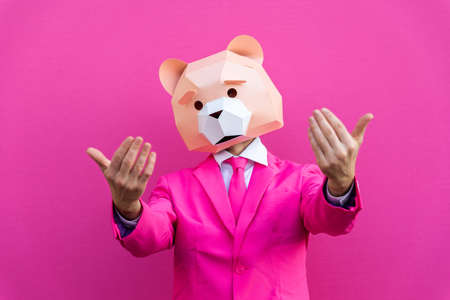 Happy man with funny low poly mask on colored background - Creative conceptual idea for advertising, adult with low-poly origami paper mask doing funny posesの写真素材