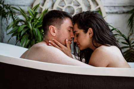 young couple spending time in their beautiful countryside house. Romantic lifestyle momentsの写真素材