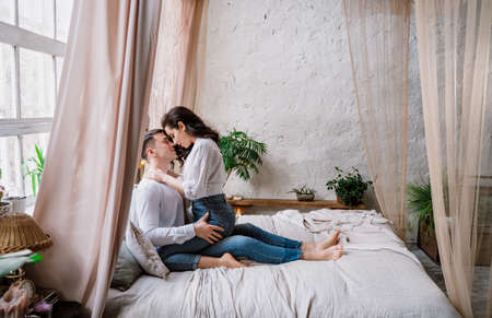 young couple spending time in their beautiful countryside houseの写真素材