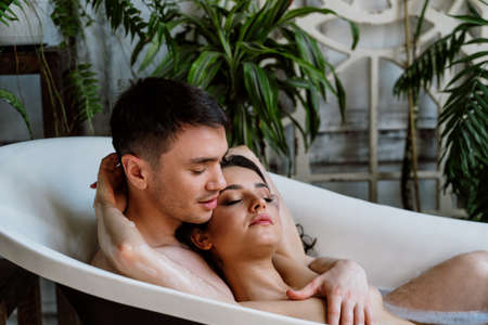 young couple spending time in their beautiful countryside house. Romantic lifestyle momentsの写真素材