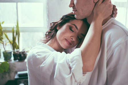 young couple spending time in their beautiful countryside houseの写真素材