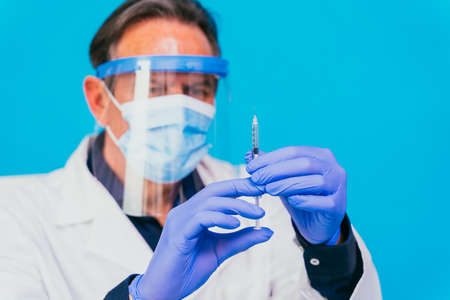 accination campaign in a clinic - People getting vaccinated from doctor and nurse to prevent  virus outbreak in a vaccination pointの写真素材