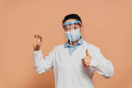 Covid-19 (coronavirus) vaccination campaign in a clinic - People getting vaccinated from doctor and nurse to prevent corona virus outbreak in a vaccination pointの写真素材