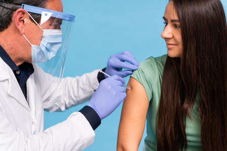 vaccination campaign in a clinic - People getting vaccinated from doctor and nurse to prevent  virus...