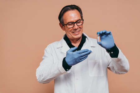 Covid-19 (coronavirus) vaccination campaign in a clinic - People getting vaccinated from doctor and nurse to prevent corona virus outbreak in a vaccination pointの写真素材