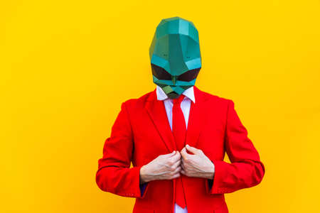 Cool man wearing 3d origami mask with stylish colored clothes - Creative concept for advertising,...