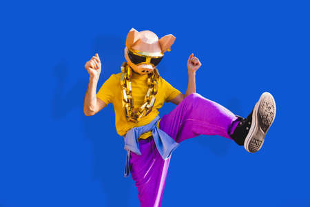 Cool man wearing 3d origami mask with stylish colored clothes - Creative concept for advertising,...