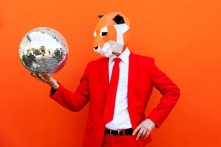 Cool man wearing 3d origami mask with stylish colored clothes - Creative concept for advertising,...