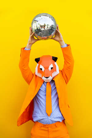 Cool man wearing 3d origami mask with stylish colored clothes - Creative concept for advertising,...