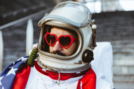 lgbt spaceman in a futuristic station. Man with space suit walking in an urban areaの写真素材