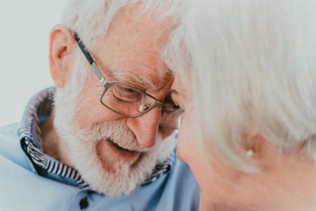 Senior couple together at home, happy moments - Elderly people taking care of each other, grandparents in love - concepts about elderly lifestyle and relationshipの写真素材