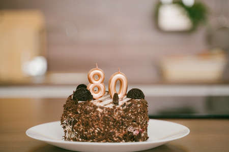 Birthday cake with candles, celebration for 80 years anniversaryの写真素材