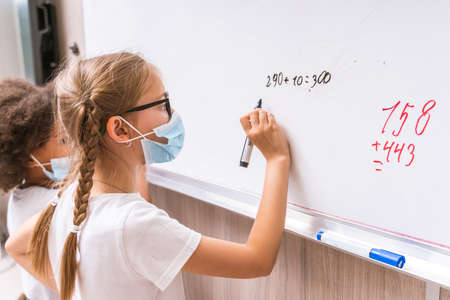 Multiracial group of kids at primary school - Playful schoolers enjoying school time and lesson with...