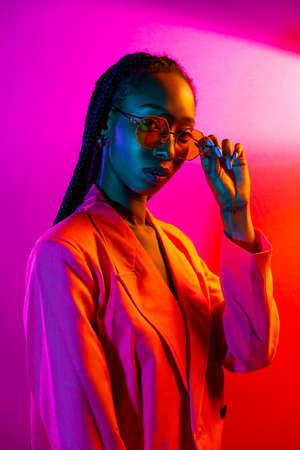 Beautiful afro-american woman with afro pigtails hairstyle and stylish clothes - Portrait of young...