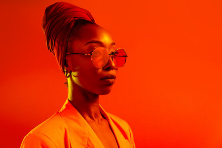 Beautiful afro-american woman with afro pigtails hairstyle and stylish clothes - Portrait of young...