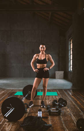 beautiful woman training and making functional workout in the gymの写真素材