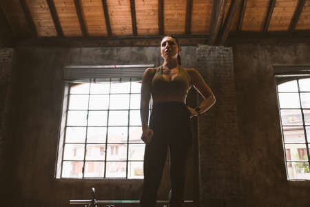 Beautiful woman training and making functional workout in the gym