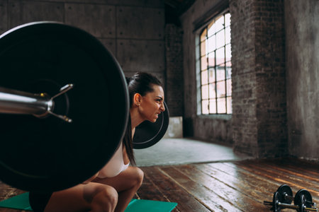 beautiful woman training and making functional workout in the gymの写真素材
