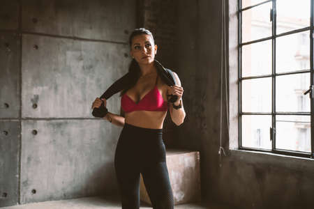 Beautiful woman training and making functional workout in the gym