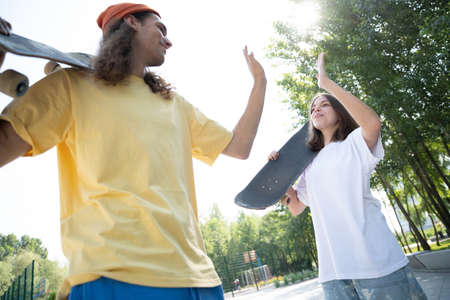 Professional skateboarders having fun at the skate park
