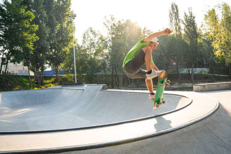 professional skateboarders having fun at the skate parkの写真素材