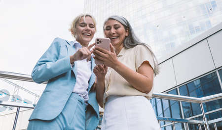 cinematic image of a multiethnic business team. employees speaking together on the balcony during the breakの写真素材