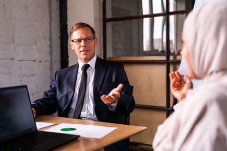 Multiethnic corporate business team meeting in the office for a strategic marketing plan - Office...