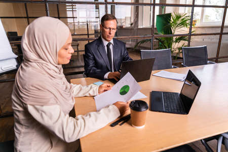 Multiethnic corporate business team meeting in the office for a strategic marketing plan - Office...
