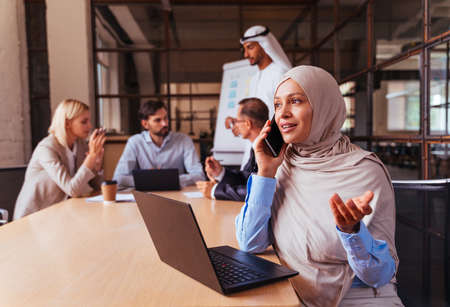 Multiethnic corporate business team meeting in the office for a strategic marketing plan - Office workers, entrepreneurs and company employee at work in a multinational companyの写真素材